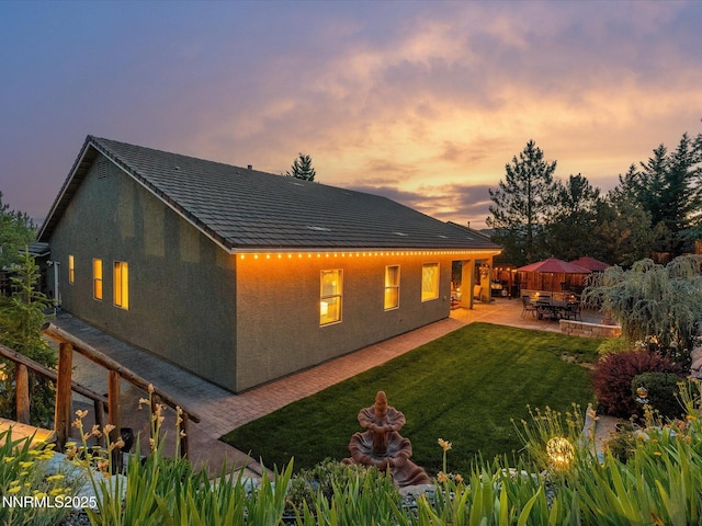 1486 Lambrays Ct, Sparks, NV 89436 - rear view of property with a patio, a yard, and stucco siding