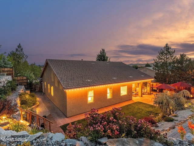 1486 Lambrays Ct, Sparks, NV 89436 - rear view of house with a patio area, stucco siding, and a tiled roof