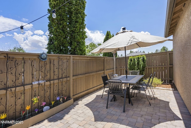 590 S Sand Crane Cir, Sparks, NV 89436 - fenced backyard with a patio and outdoor dining area
