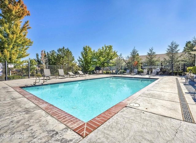 590 S Sand Crane Cir, Sparks, NV 89436 - community pool featuring a patio