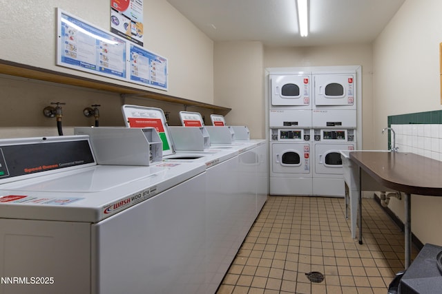 2450 Lymbery St Unit 331, Reno, NV 89509 - community laundry with stacked washer / drying machine, washer and dryer, and light tile patterned floors