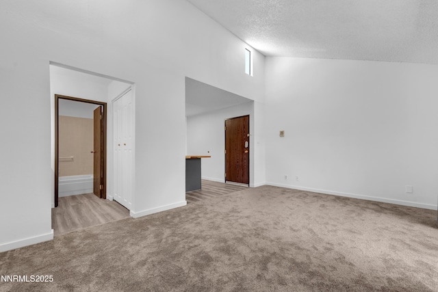 2450 Lymbery St Unit 331, Reno, NV 89509 - carpeted empty room with a high ceiling and a textured ceiling