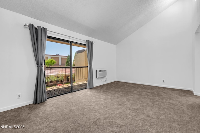 2450 Lymbery St Unit 331, Reno, NV 89509 - carpeted spare room featuring vaulted ceiling, a textured ceiling, and a wall mounted air conditioner
