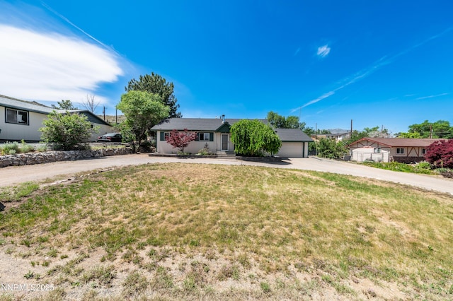 8720 Aquifer Way, Reno, NV 89506 - ranch-style home with driveway, a front lawn, and a garage