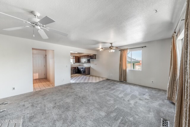 8720 Aquifer Way, Reno, NV 89506 - unfurnished living room featuring ceiling fan, light carpet, and a textured ceiling