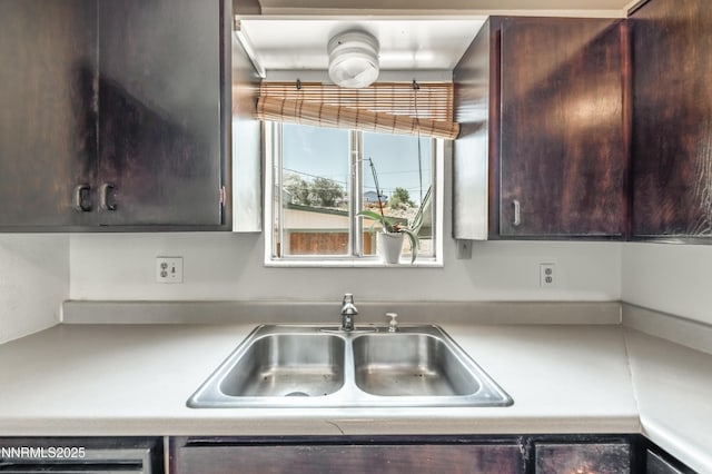 8720 Aquifer Way, Reno, NV 89506 - kitchen with dark brown cabinets, light countertops, and dishwasher