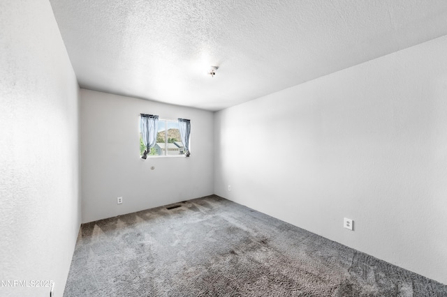 8720 Aquifer Way, Reno, NV 89506 - carpeted empty room featuring a textured ceiling