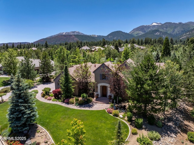 16956 Rue Du Parc Ave, Reno, NV 89511 - view of front of house with a mountain view, a front yard, and stucco siding