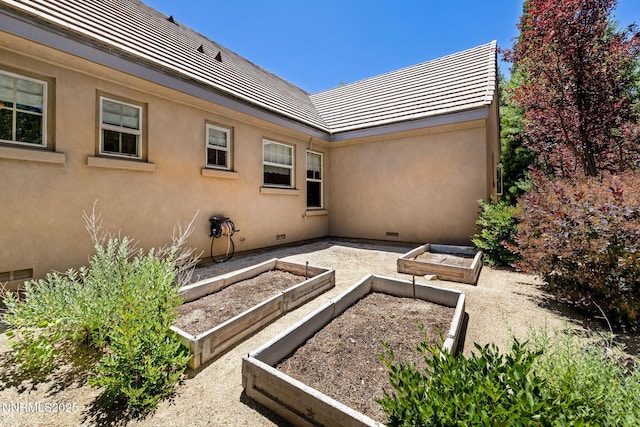 16956 Rue Du Parc Ave, Reno, NV 89511 - view of patio featuring a garden
