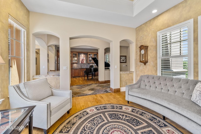 16956 Rue Du Parc Ave, Reno, NV 89511 - living area featuring arched walkways, light wood finished floors, and recessed lighting