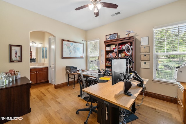 16956 Rue Du Parc Ave, Reno, NV 89511 - office with a ceiling fan, light wood finished floors, arched walkways, and plenty of natural light