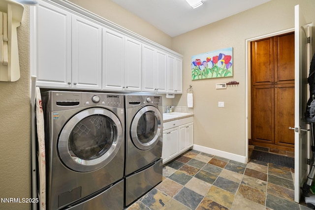 16956 Rue Du Parc Ave, Reno, NV 89511 - washroom with stone tile flooring, cabinet space, and washer and dryer