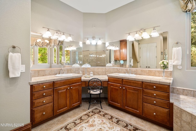 16956 Rue Du Parc Ave, Reno, NV 89511 - full bath featuring double vanity, a chandelier, decorative backsplash, and tile patterned floors