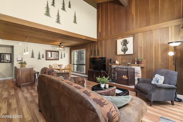 123 Juanita Dr Unit 1-7, Incline Village, NV 89451 - living room featuring wood walls, ceiling fan, wood finished floors, and a brick fireplace