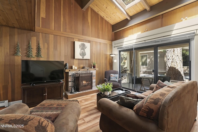 123 Juanita Dr Unit 1-7, Incline Village, NV 89451 - living area with a wood ceiling with exposed beams, wooden walls, wood finished floors, a fireplace, and healthy amount of natural light