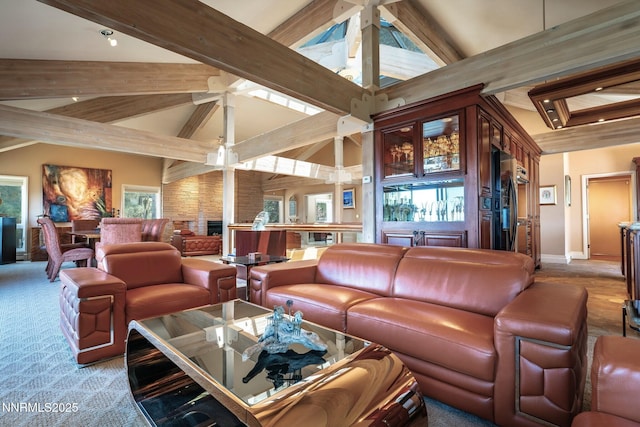 275 Chukkar Dr, Glenbrook, NV 89413 - living room with beamed ceiling, healthy amount of natural light, a ceiling fan, and high vaulted ceiling