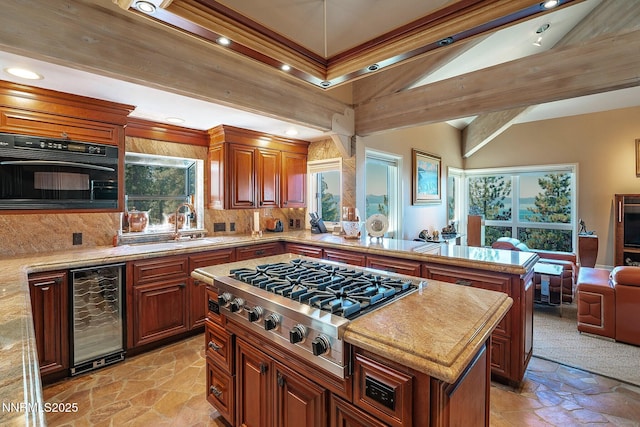 275 Chukkar Dr, Glenbrook, NV 89413 - kitchen with wine cooler, stainless steel gas cooktop, stone tile floors, healthy amount of natural light, and vaulted ceiling