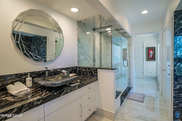 275 Chukkar Dr, Glenbrook, NV 89413 - bathroom featuring vanity, a marble finish shower, marble finish flooring, and recessed lighting