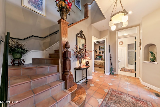 171 Mill St, Genoa, NV 89411 - stairs with tile patterned floors and a ceiling fan