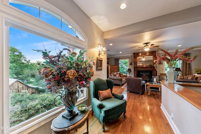 171 Mill St, Genoa, NV 89411 - living room with a warm lit fireplace, ceiling fan, wood finished floors, and recessed lighting