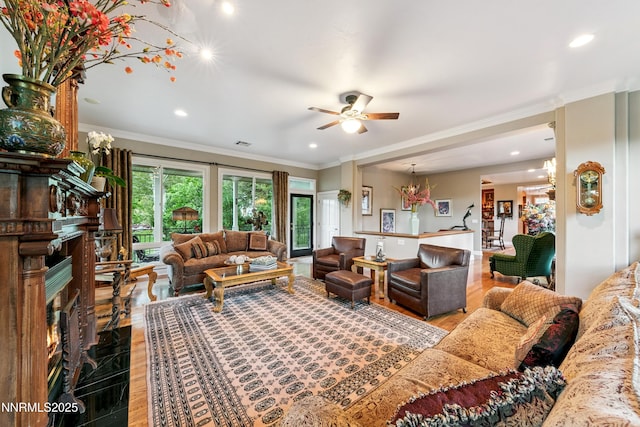 171 Mill St, Genoa, NV 89411 - living room featuring ceiling fan, recessed lighting, crown molding, a fireplace, and a chandelier