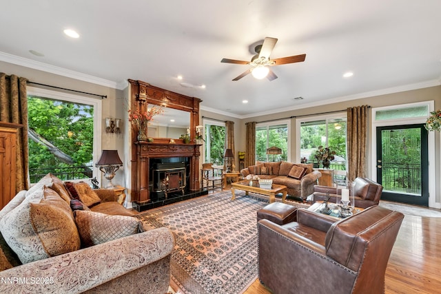 171 Mill St, Genoa, NV 89411 - living area featuring healthy amount of natural light, ceiling fan, recessed lighting, ornamental molding, and a glass covered fireplace
