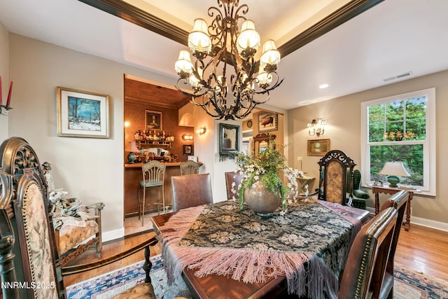 171 Mill St, Genoa, NV 89411 - dining room featuring a chandelier, wood finished floors, and crown molding