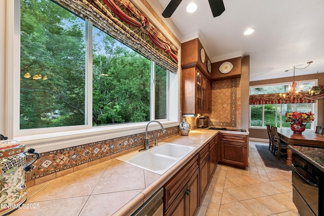171 Mill St, Genoa, NV 89411 - kitchen featuring tile countertops, black appliances, backsplash, light tile patterned floors, and a chandelier