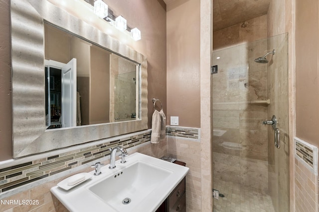 171 Mill St, Genoa, NV 89411 - full bathroom featuring a shower stall, tile walls, and vanity