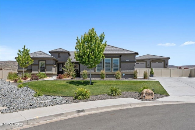 10 Diamond Strm Ct, Sparks, NV 89441 - prairie-style house featuring driveway, stucco siding, and a tiled roof