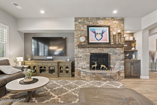 10 Diamond Strm Ct, Sparks, NV 89441 - living area with wood finished floors, a stone fireplace, and recessed lighting