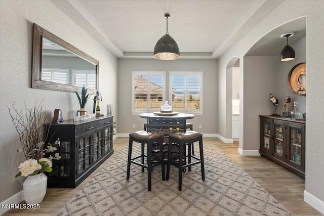10 Diamond Strm Ct, Sparks, NV 89441 - dining area with arched walkways and wood finished floors