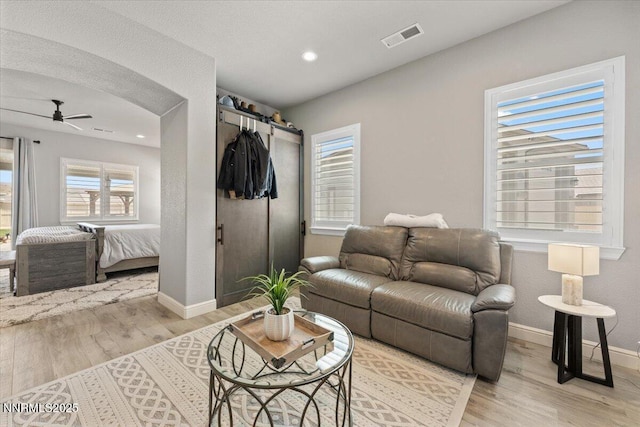 10 Diamond Strm Ct, Sparks, NV 89441 - living area with light wood-style flooring, a barn door, ceiling fan, and recessed lighting