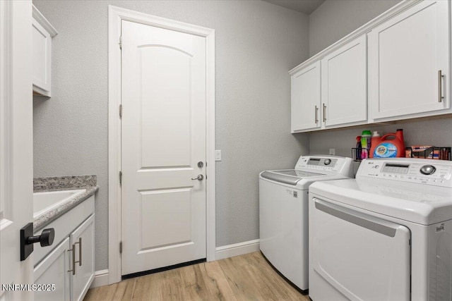 10 Diamond Strm Ct, Sparks, NV 89441 - washroom featuring separate washer and dryer, light wood-type flooring, and cabinet space