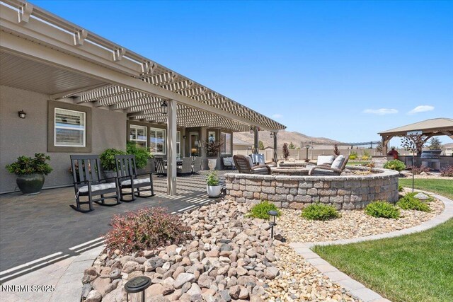 10 Diamond Strm Ct, Sparks, NV 89441 - view of patio / terrace featuring a fire pit and a pergola