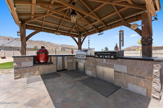 10 Diamond Strm Ct, Sparks, NV 89441 - view of patio with an outdoor kitchen, a gazebo, and a mountain view