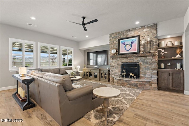 10 Diamond Strm Ct, Sparks, NV 89441 - living room featuring a ceiling fan, wood finished floors, a stone fireplace, and recessed lighting