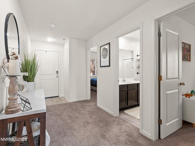 9237 Logan Creek Rd, Reno, NV 89506 - corridor with light carpet and baseboards