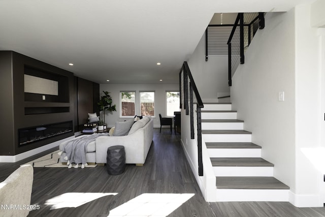 3323 Deer Ridge Ct, Reno, NV 89509 - living area featuring stairway, wood finished floors, a glass covered fireplace, and recessed lighting