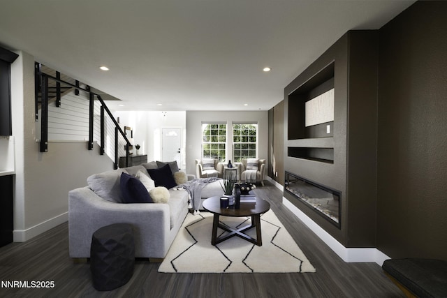 3323 Deer Ridge Ct, Reno, NV 89509 - living room with wood finished floors, stairway, recessed lighting, and a glass covered fireplace
