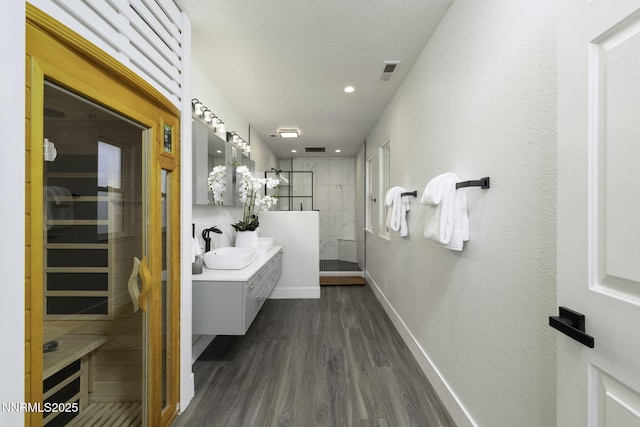 3323 Deer Ridge Ct, Reno, NV 89509 - full bath featuring tiled shower, vanity, wood finished floors, a sauna / steam room, and recessed lighting