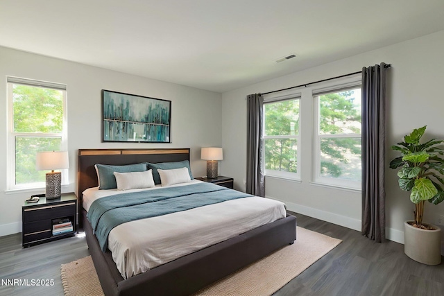 3323 Deer Ridge Ct, Reno, NV 89509 - bedroom featuring multiple windows and wood finished floors