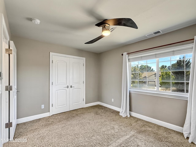 6348 Chilhowee Ct, Sparks, NV 89436 - unfurnished bedroom with a closet, light carpet, and a ceiling fan