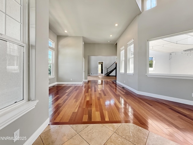 6348 Chilhowee Ct, Sparks, NV 89436 - unfurnished living room featuring hardwood / wood-style floors, stairway, and recessed lighting