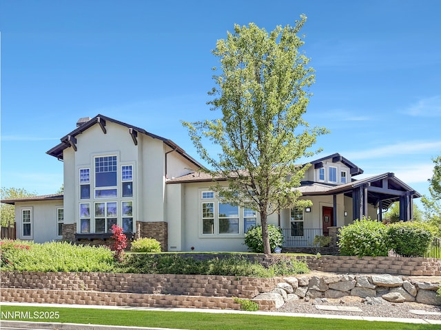 6348 Chilhowee Ct, Sparks, NV 89436 - view of front of property featuring stucco siding, stone siding, and a porch