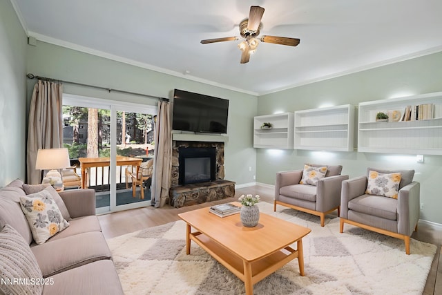 807 Alder Ave Unit 61, Incline Village, NV 89451 - living room with ornamental molding, ceiling fan, a stone fireplace, and wood finished floors