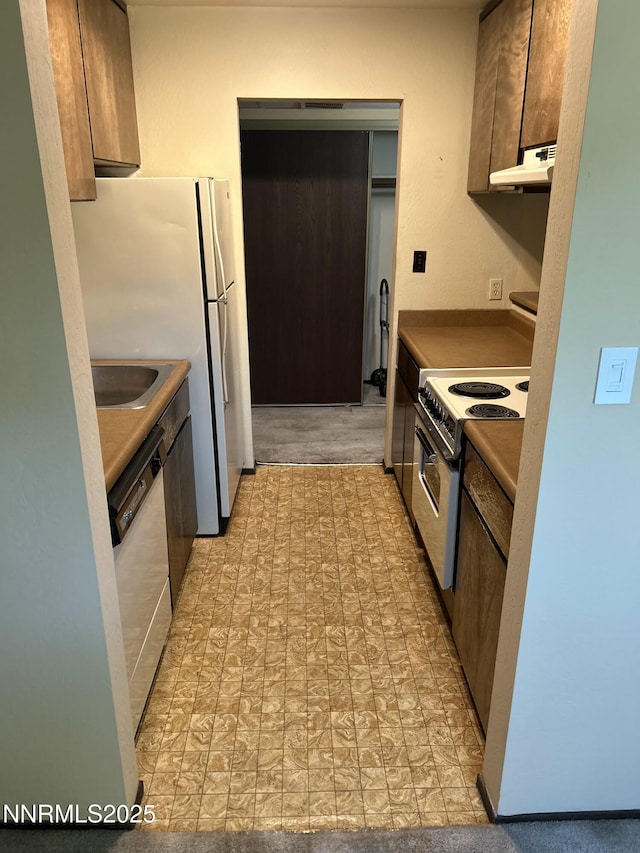 1000 Beck St Unit 361, Reno, NV 89509 - kitchen featuring electric range, dishwashing machine, and under cabinet range hood
