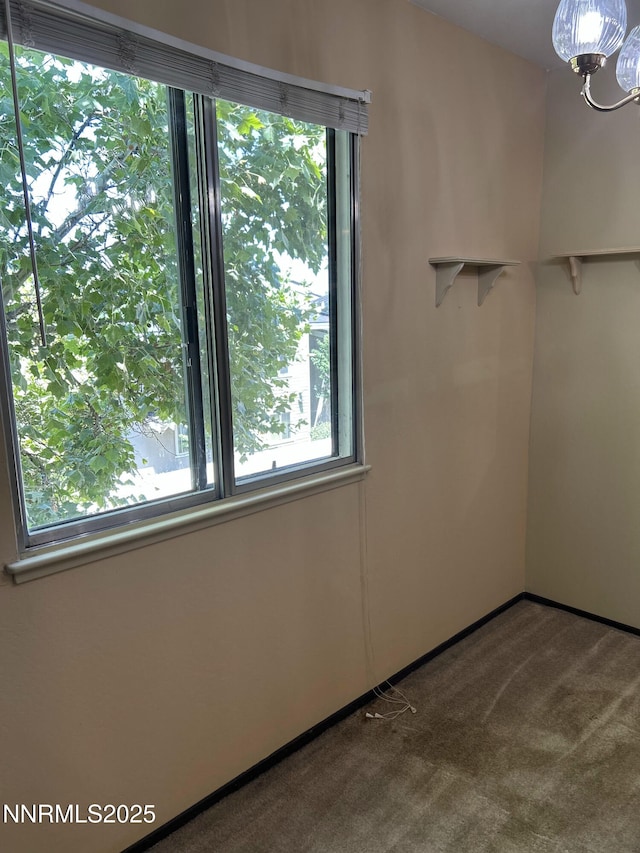 1000 Beck St Unit 361, Reno, NV 89509 - carpeted empty room with a chandelier