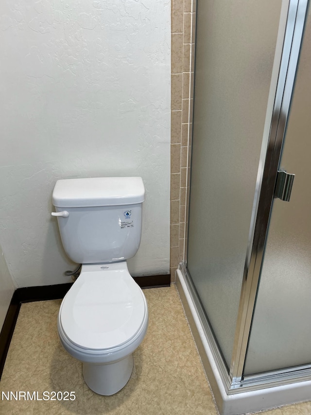 1000 Beck St Unit 361, Reno, NV 89509 - full bath featuring a shower stall, tile patterned floors, and a textured wall