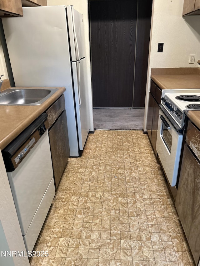 1000 Beck St Unit 361, Reno, NV 89509 - kitchen featuring white appliances and dark brown cabinetry